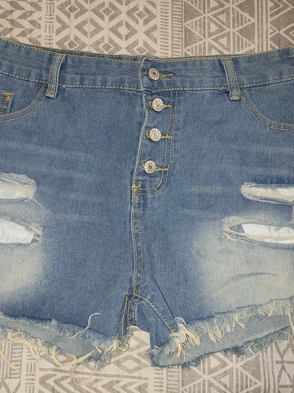 Button-Front Distressed Denim Shorts in Light Blue